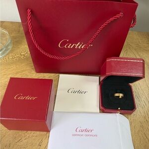 Cartier 18k Gold Love Ring with original packaging and authenticity provided.